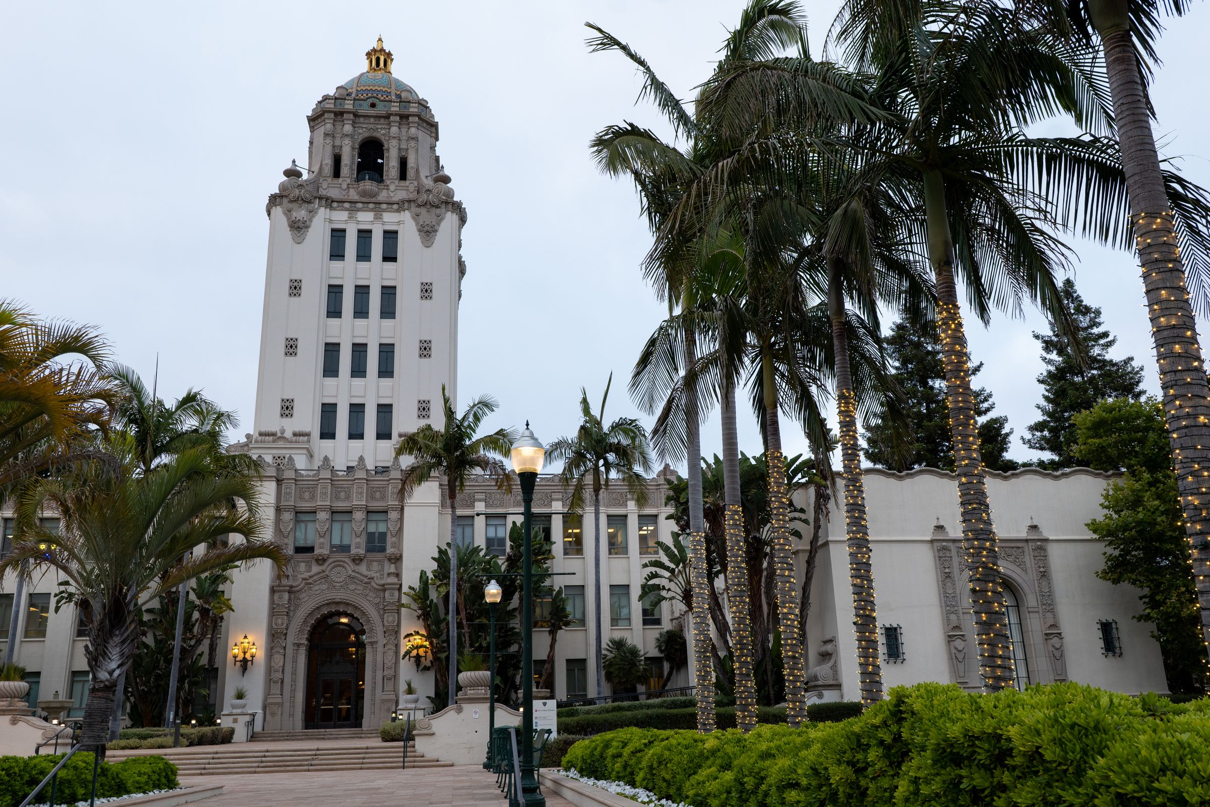 Beverly Hills City Hall framed by illuminated palm trees